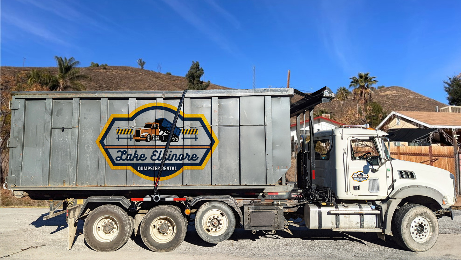 Lake Elsinore Dumpster Rental truck delivering dumpster in Lake Elsinore